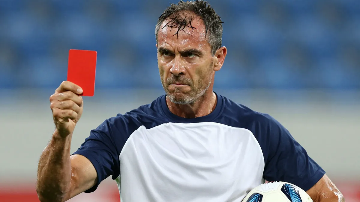 Middle-aged, muscular Sandefjord midfielder, mid-30s, head-and-shoulders, drenched in sweat, eyes fierce, wearing an...